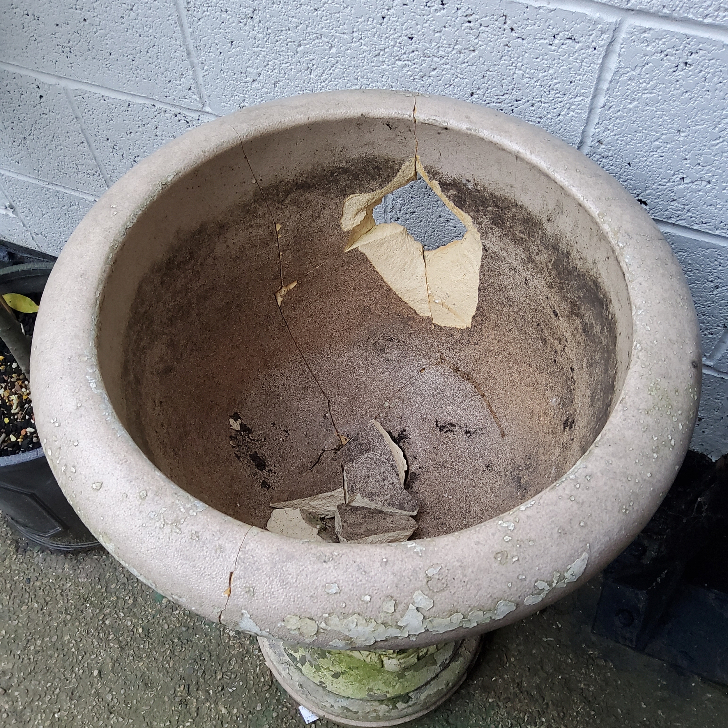 A 19th century reconstituted Country House urn on fluted plinth, with distressed traces of white - Image 2 of 2