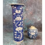 A Chinese cylindrical vase, decorated with prunus blossom on a blue ground, 30.5cm high, Kangxi