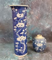 A Chinese cylindrical vase, decorated with prunus blossom on a blue ground, 30.5cm high, Kangxi