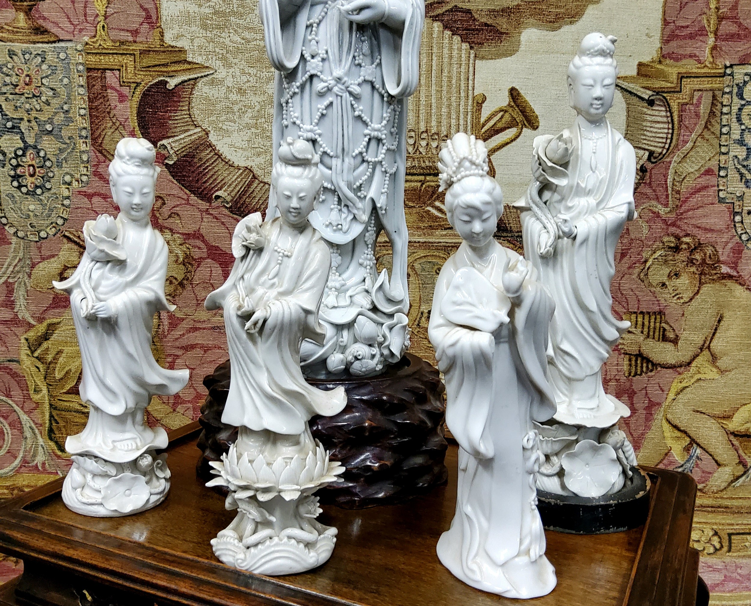 Four 19th century Blanc de Chine figure, Guanyin, standing holding a lotus, 22cm high;  another, - Image 2 of 3