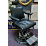 A 1950s Belmont barbers chairs, adjustable headrest, chromed fittings, on stepped weighted base.