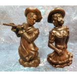 A pair of 19th century German hardwood carvings, of a musician and dancer, half length, 19.5cm high,