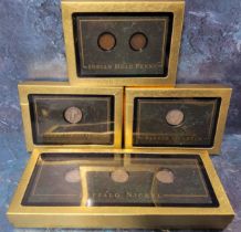 Numismatics - Four presentation boxes holding American coin examples in faux marble presentation