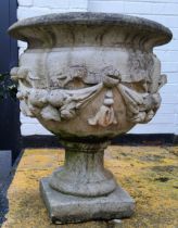 A substantial reconstituted stone country house urn