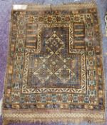 A woollen prayer rug, 43in x 36in