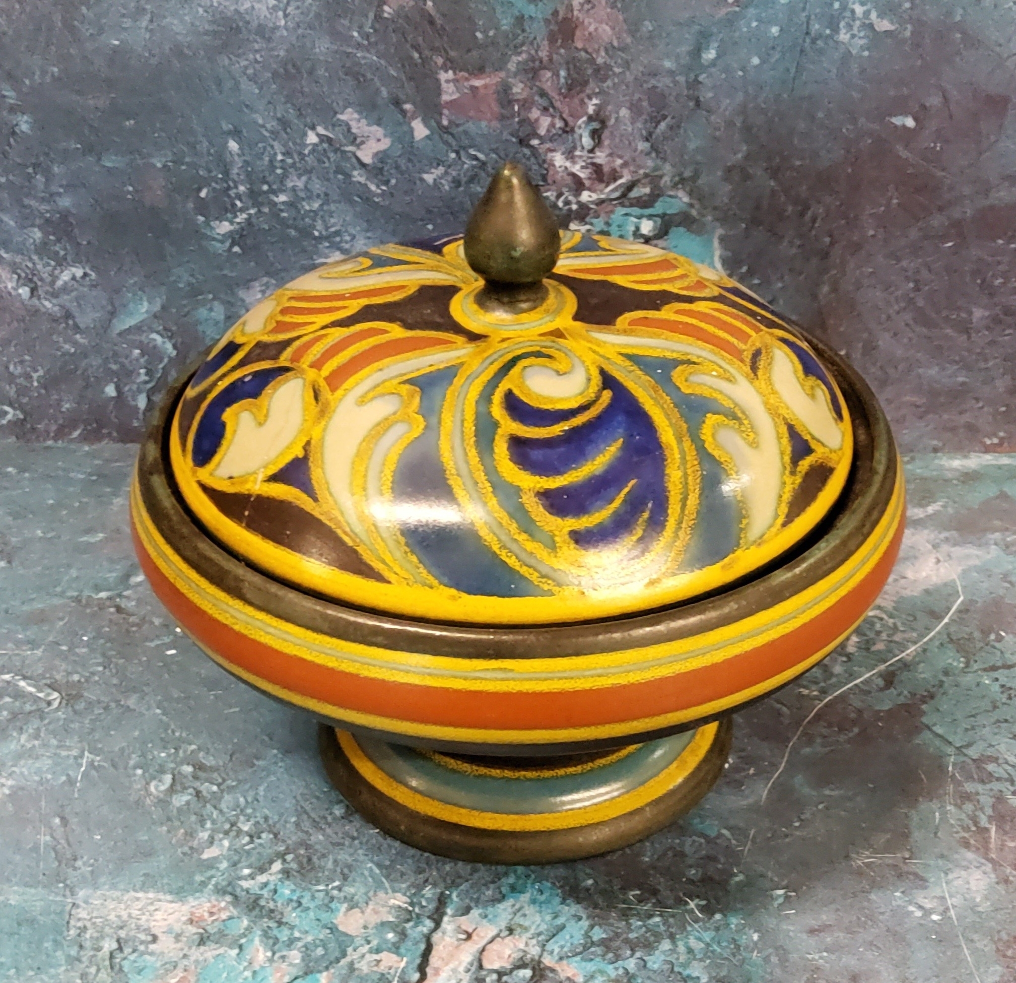 A Gouda Gladys pattern pedestal bowl and cover, 13cm high, painted marks, 899