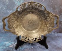 An Art Nouveau 'Tudric' pewter two handled dish, hammered, pierced and in relief with clover, 28.5cm