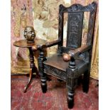 A late 17th century and later English oak Wainscot type country house hall chair, profusely carved