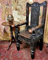 A late 17th century and later English oak Wainscot type country house hall chair, profusely carved