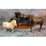 A Royal Doulton model, Black Beauty and Foal,  on wooden plinth;  another, Midnight;  a Royal