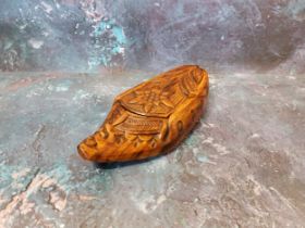 An early 20th century continental hardwood shoe, carved with flowers, 18cm long