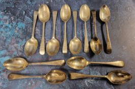 Twelve Old English pattern teaspoons, each engraved S.W. over a year starting 1927 to 1938, C W