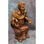 A '17th century' Continental painted softwood figure, Moses, seated, holding a tablet, 44cm high