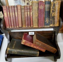 An oak book rest, 42cm wide, c.1930;   another, smaller, 32cm wide;  Collins Library of Classics