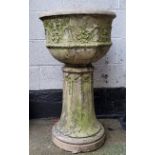 A 19th century reconstituted Country House urn on fluted plinth, with distressed traces of white