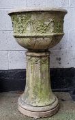 A 19th century reconstituted Country House urn on fluted plinth, with distressed traces of white