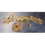 A 9ct gold shaped bar brooch, the suspended central scroll work terminating in leaves, centrally