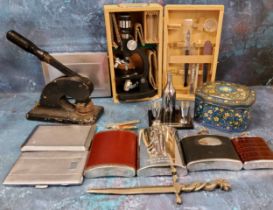 A Towa microscope, boxed;  hip flasks;  chrome plated cigarette box;  pen knives;  cast iron stamp;