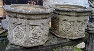 A pair of impressive reconstituted stone planters, each decorated with Yorkshire Rose in relief to