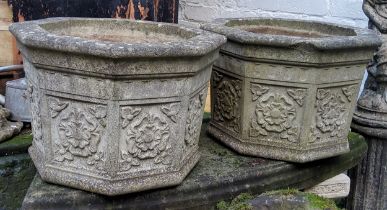 A pair of impressive reconstituted stone planters, each decorated with Yorkshire Rose in relief to