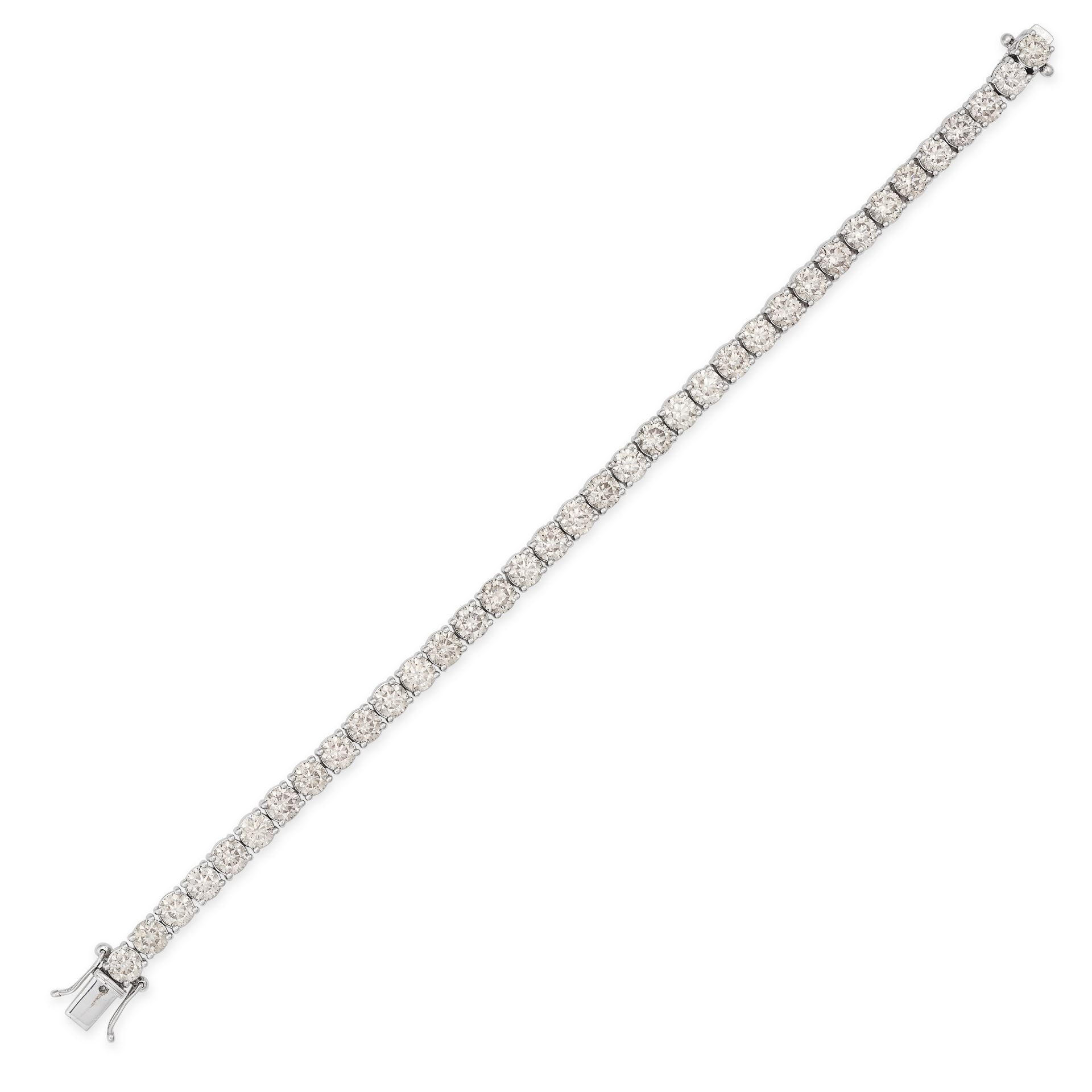 A DIAMOND LINE BRACELET in 18ct white gold, comprising a row of round brilliant cut diamonds, the...