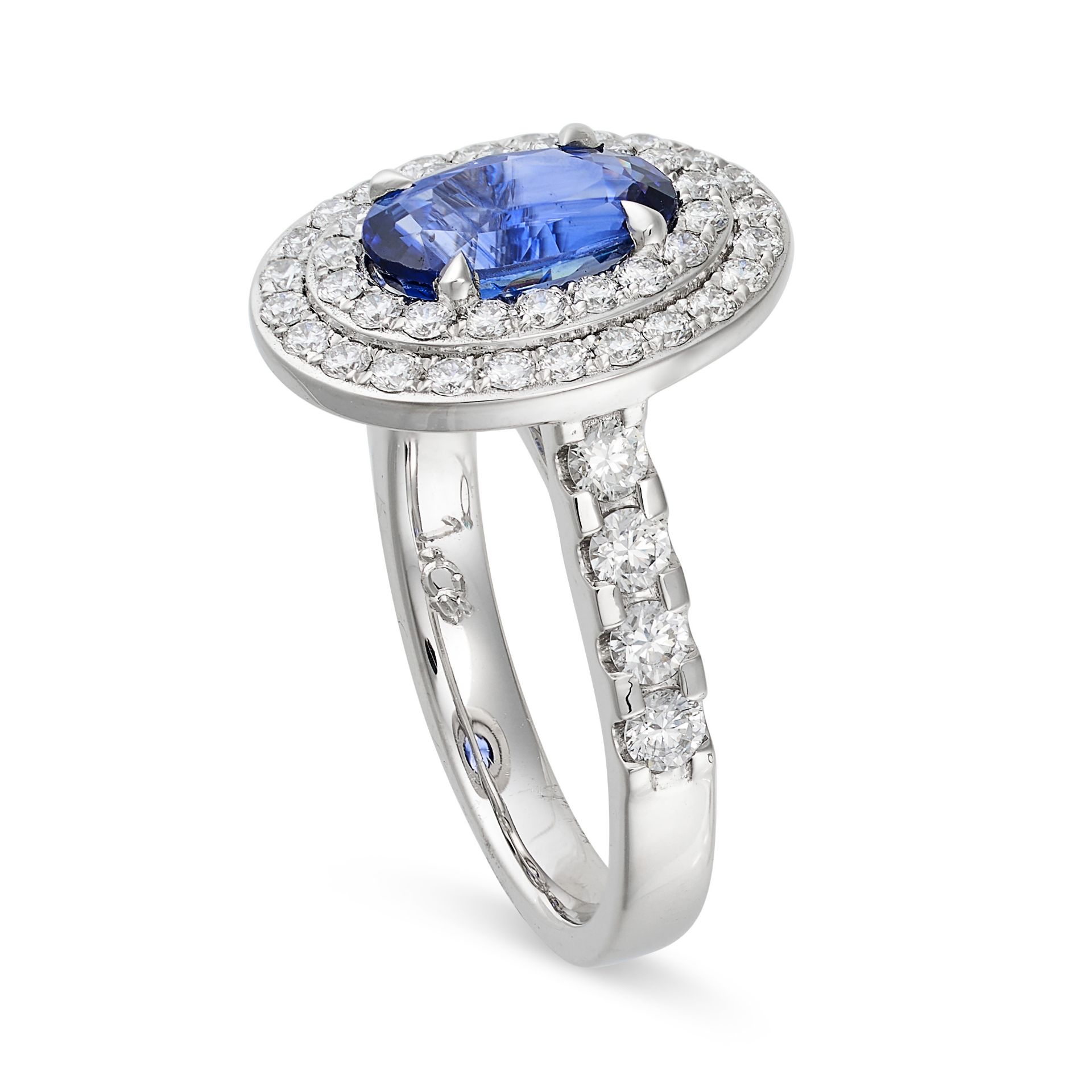 A SAPPHIRE AND DIAMOND CLUSTER RING in platinum, set to the centre with an oval cut sapphire of 2... - Image 2 of 2