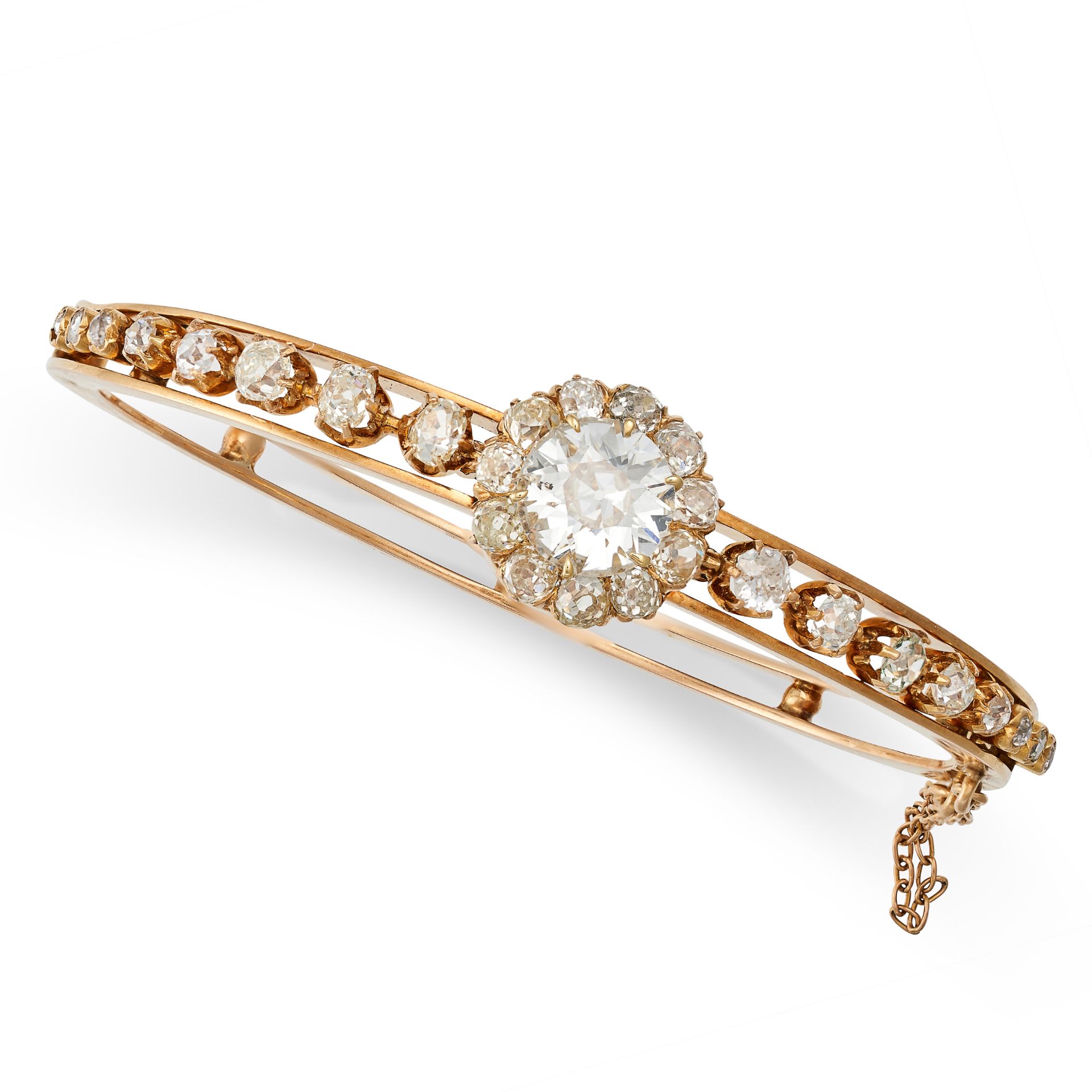 A FINE ANTIQUE VICTORIAN DIAMOND BANGLE, 19TH CENTURY in yellow gold, the hinged body set with an...