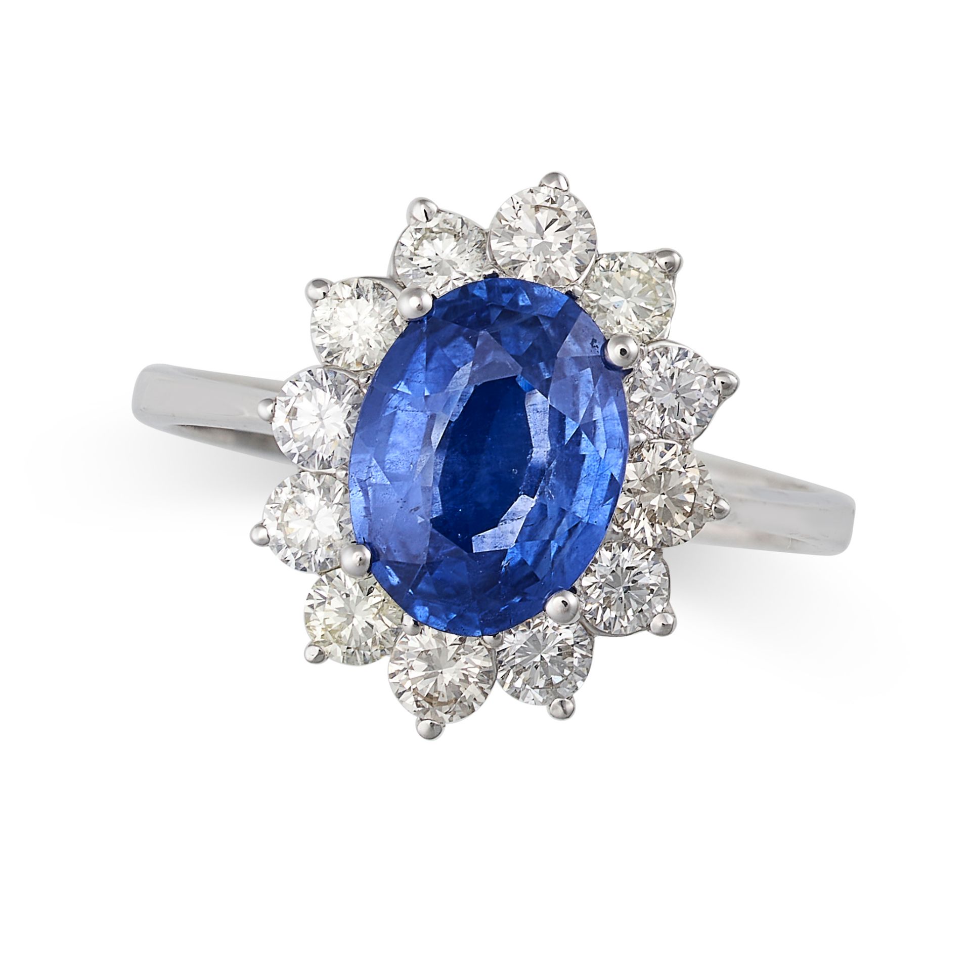 A SAPPHIRE AND DIAMOND CLUSTER RING in 18ct white gold, set with an oval cut sapphire of 2.32 car...