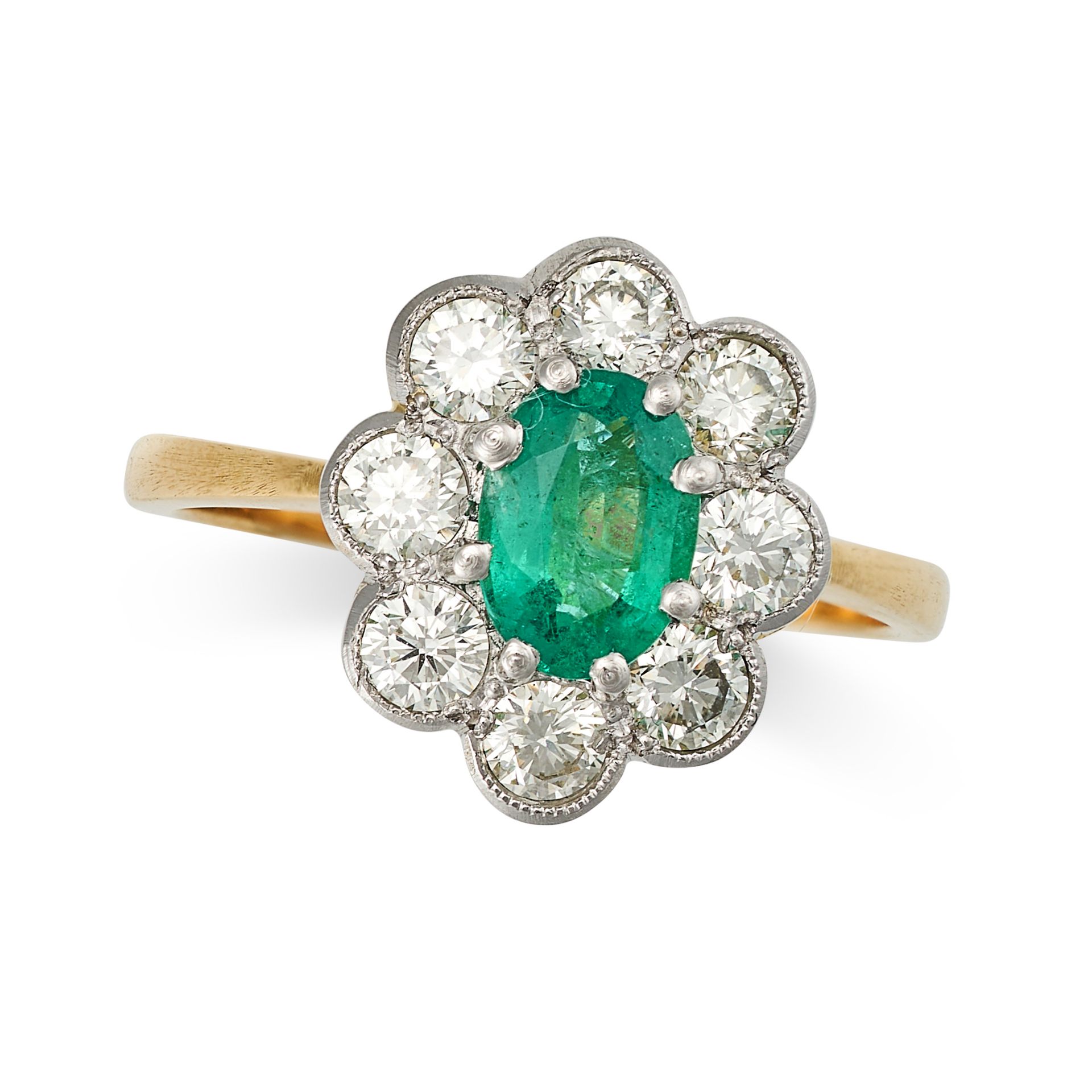 AN EMERALD AND DIAMOND CLUSTER RING in yellow gold, set with an oval cut emerald in a cluster of ...