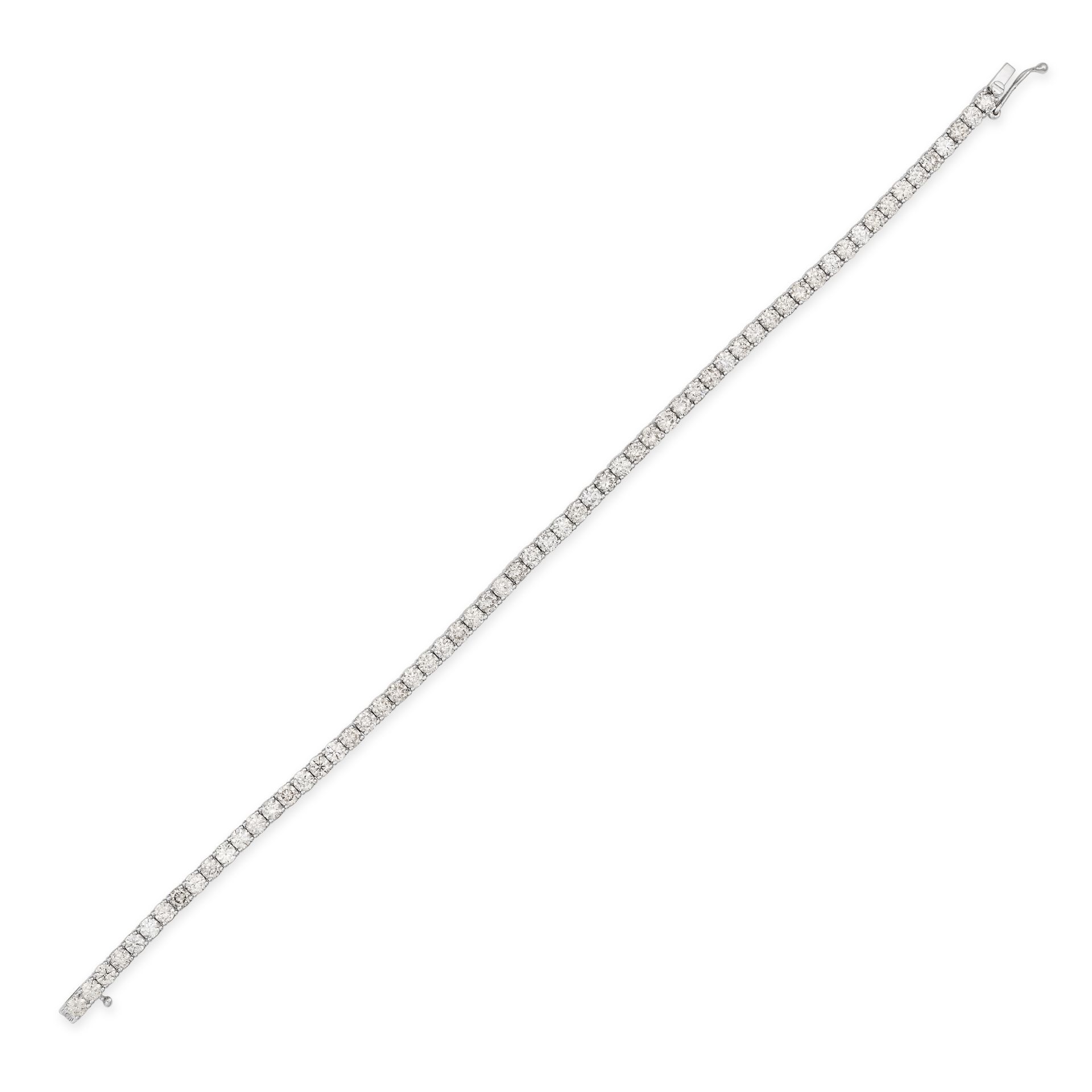 A DIAMOND LINE BRACELET in 18ct white gold, comprising a row of round brilliant cut diamonds, the...