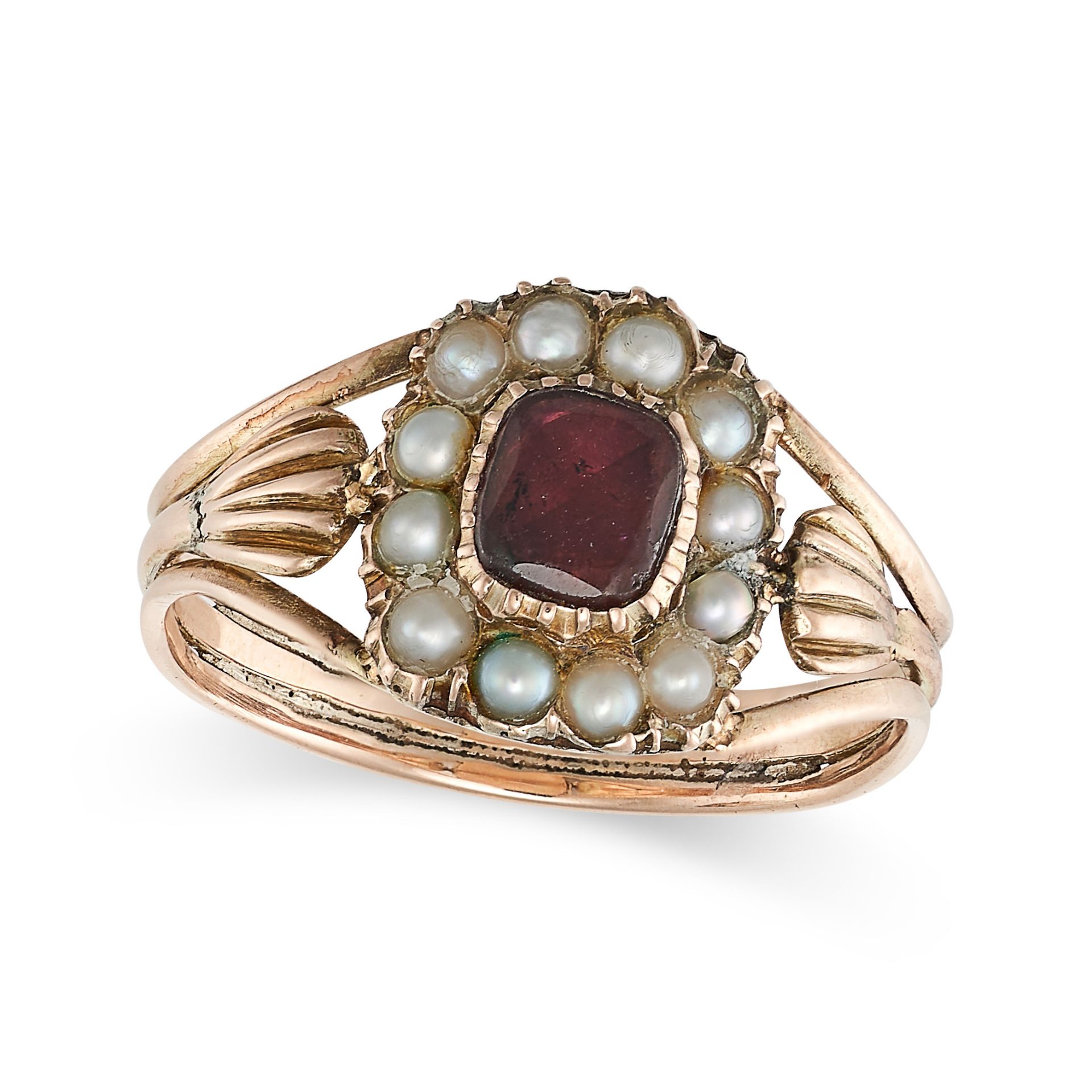 AN ANTIQUE GARNET AND PEARL RING, 19TH CENTURY in yellow gold, set with a cushion cut garnet in a...