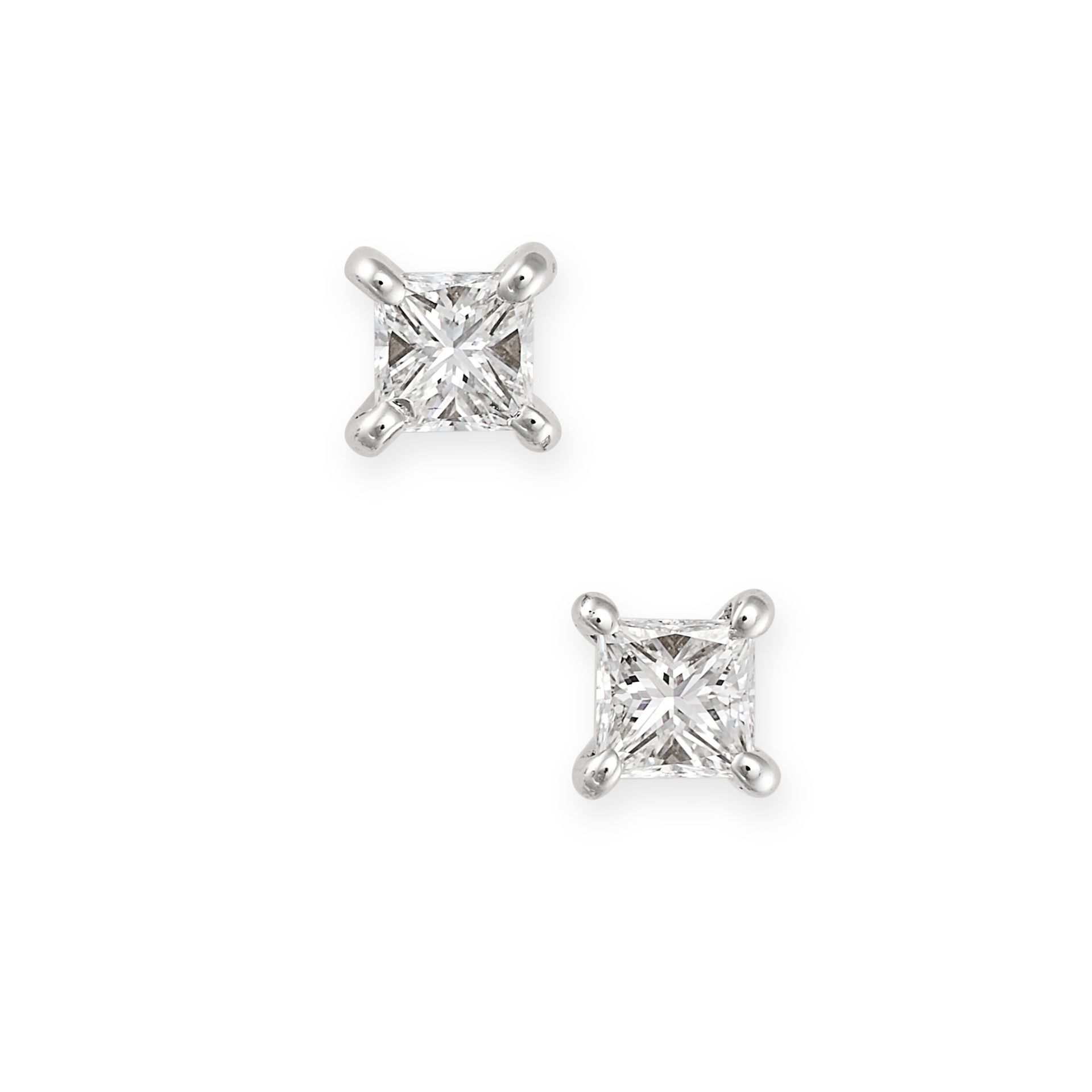 A PAIR OF DIAMOND STUD EARRINGS in 18ct white and yellow gold, each set with a princess cut diamo...