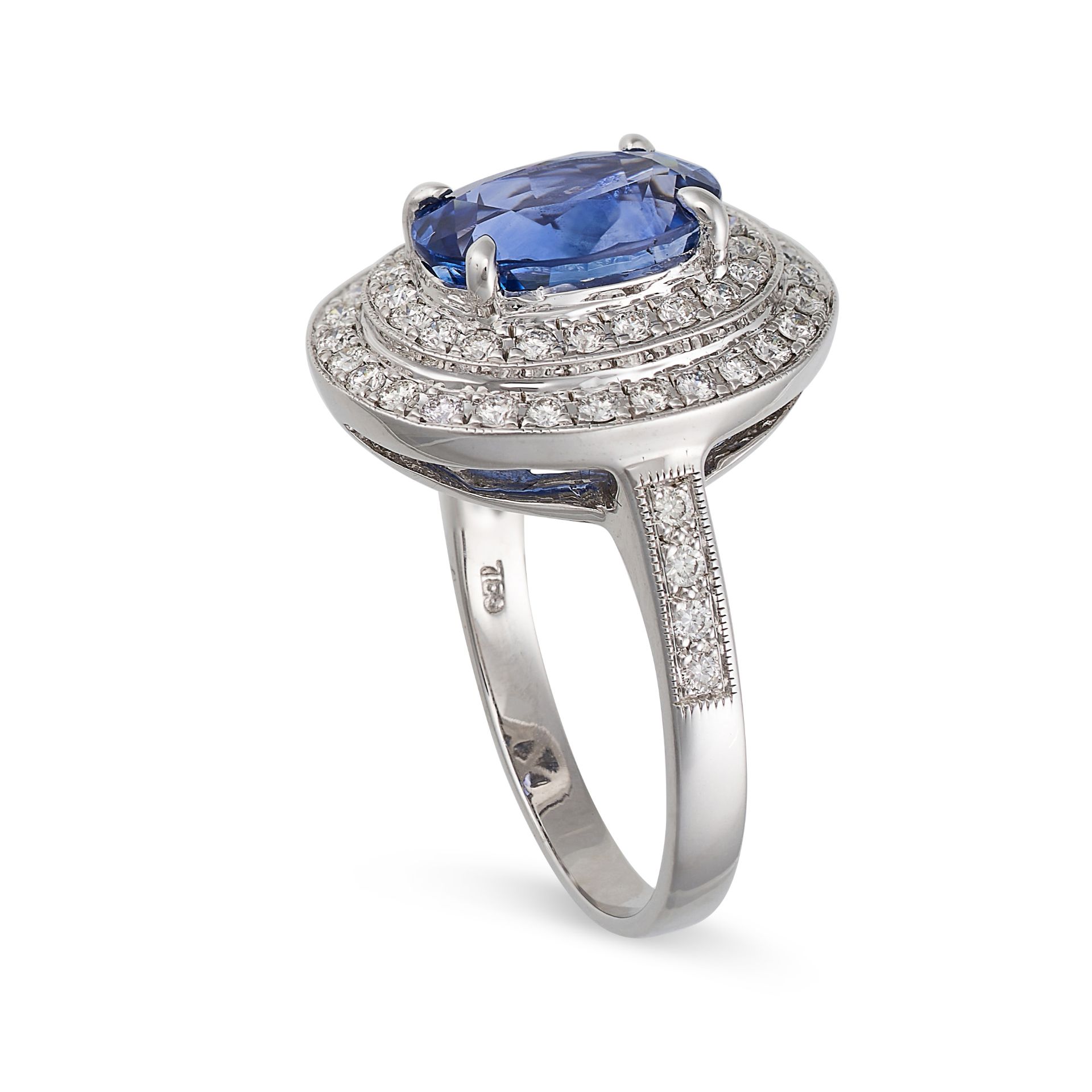 A SAPPHIRE AND DIAMOND CLUSTER RING in 18ct white gold, set with an oval cut sapphire of 2.40 car... - Image 2 of 2