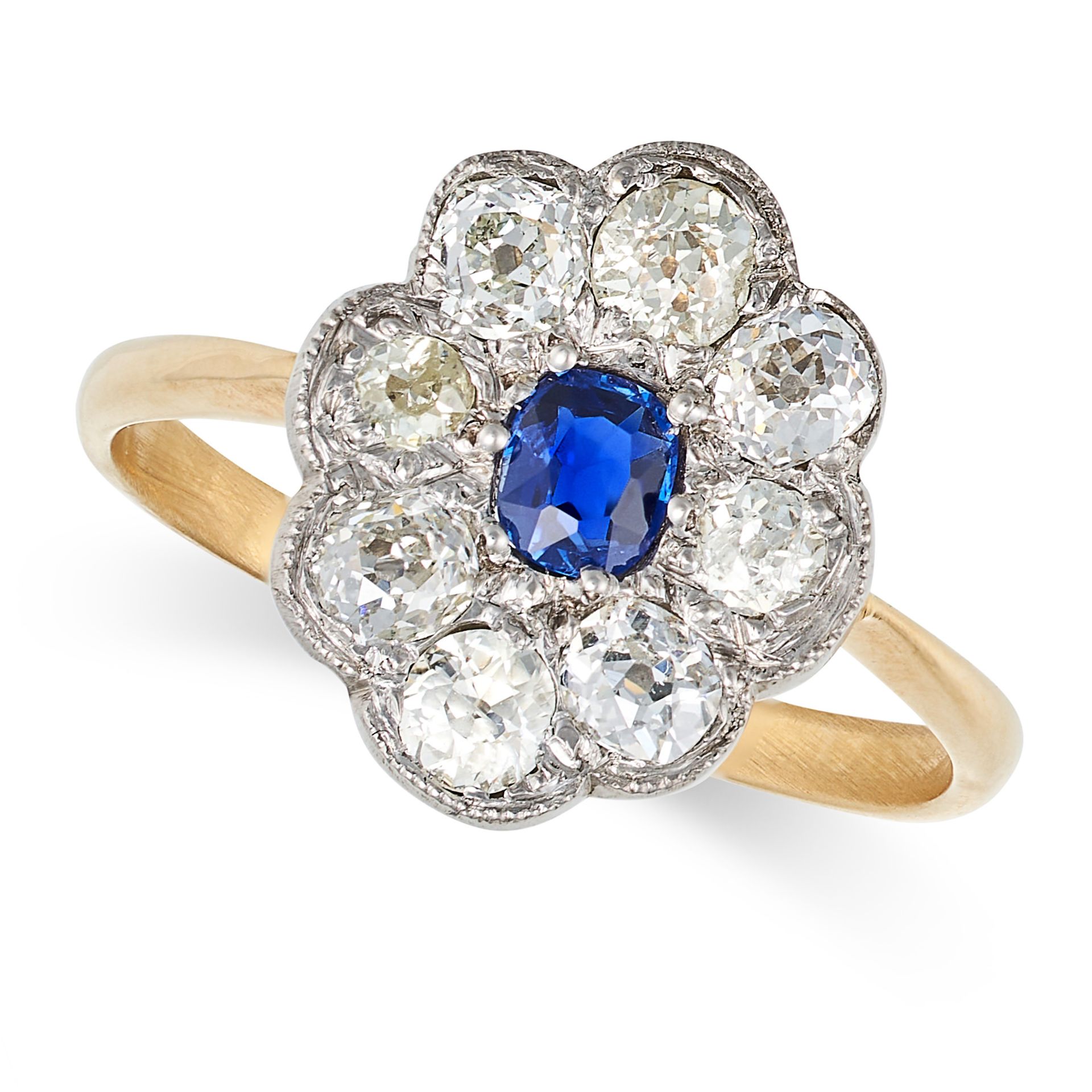 A SAPPHIRE AND DIAMOND CLUSTER RING in yellow gold, set with an oval cut sapphire in a cluster of...