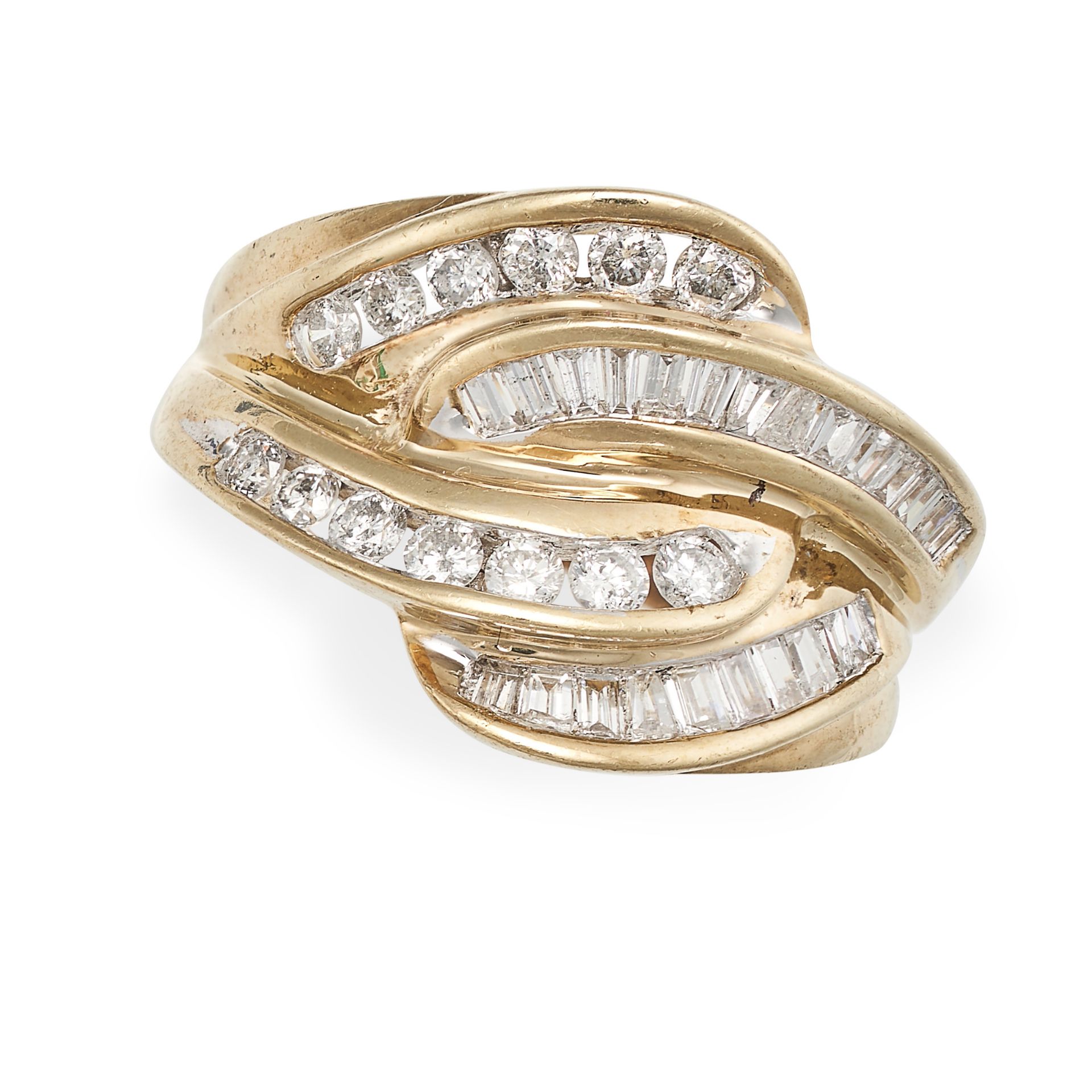 A DIAMOND RING in scrolling design set with round brilliant and baguette cut diamonds, no assay m...