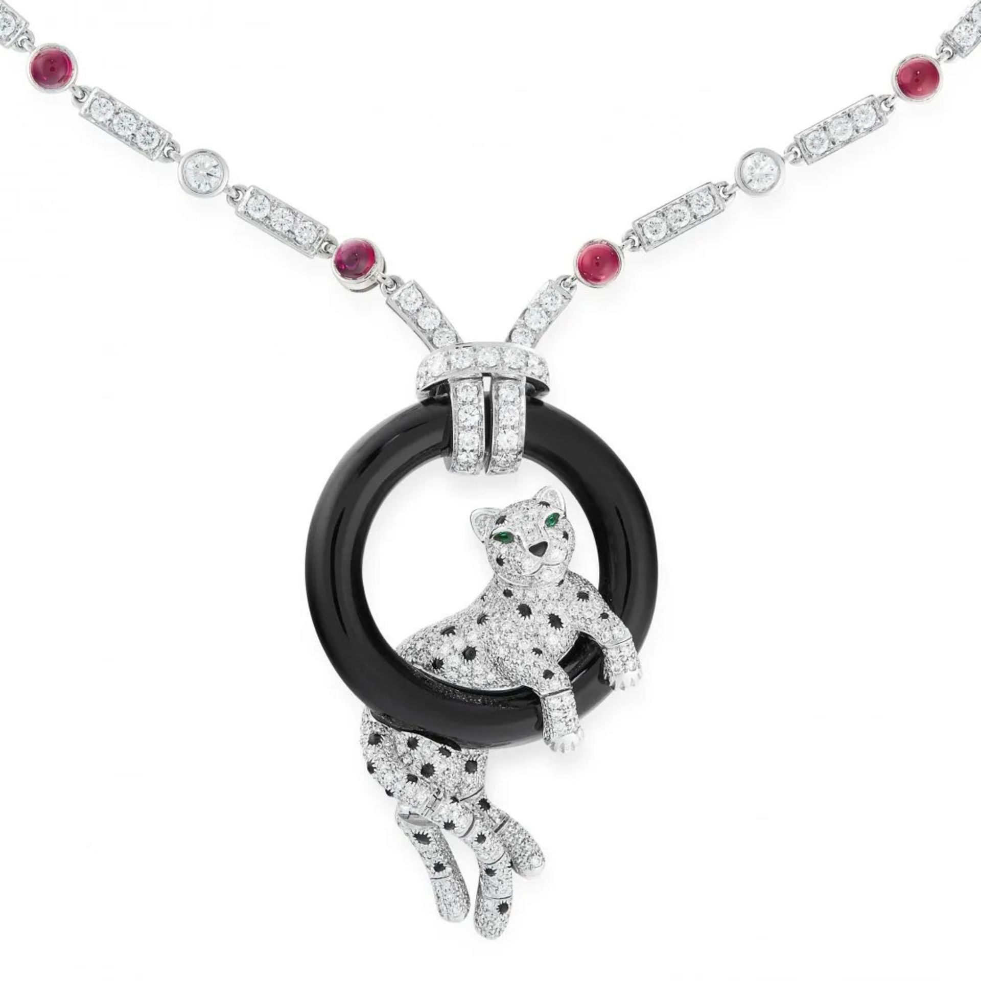 A RUBY, DIAMOND, EMERALD AND ONYX PANTHER PENDANT NECKLACE in platinum, the chain set with altern...