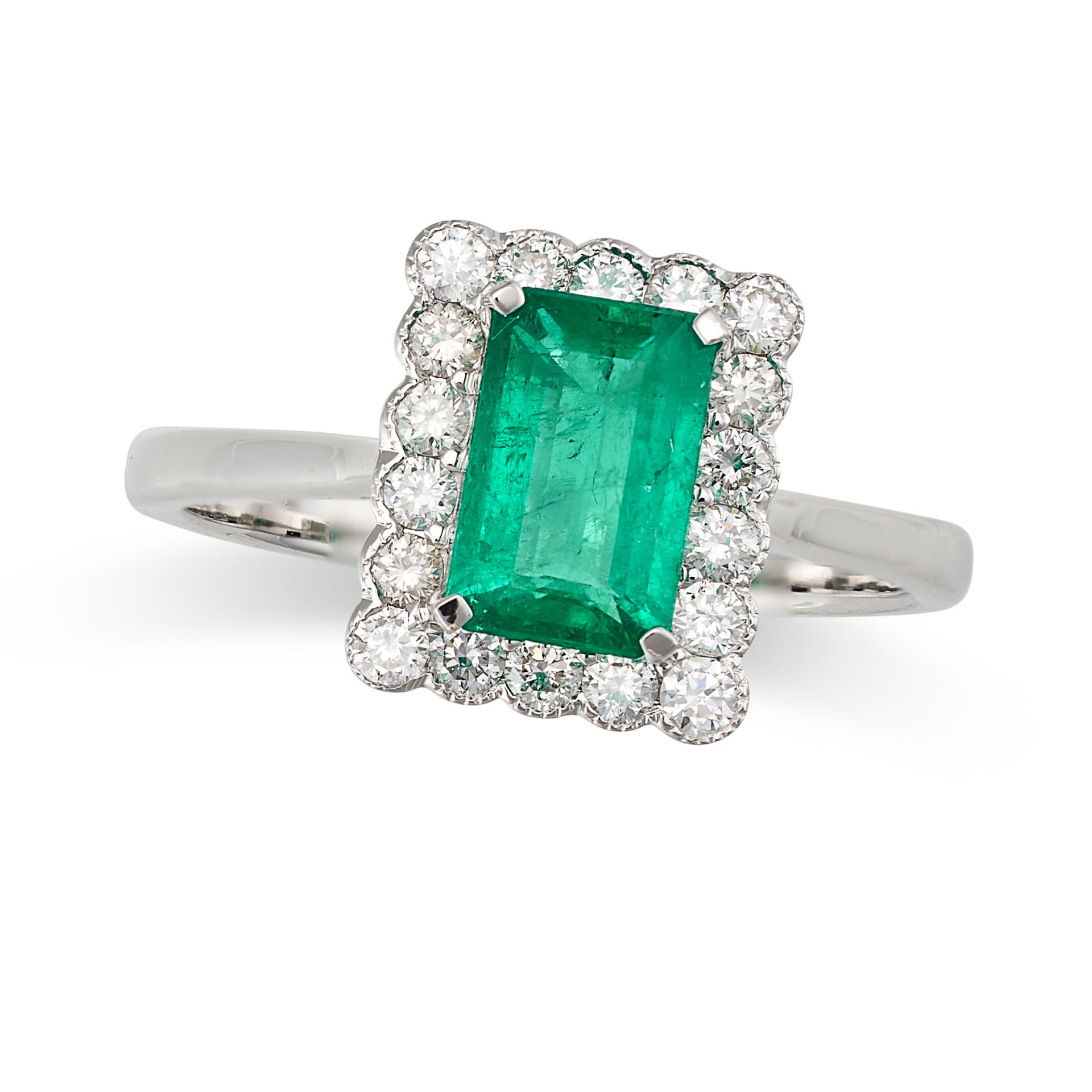 AN EMERALD AND DIAMOND CLUSTER RING in 18ct white gold, set with an octagonal step cut emerald of...