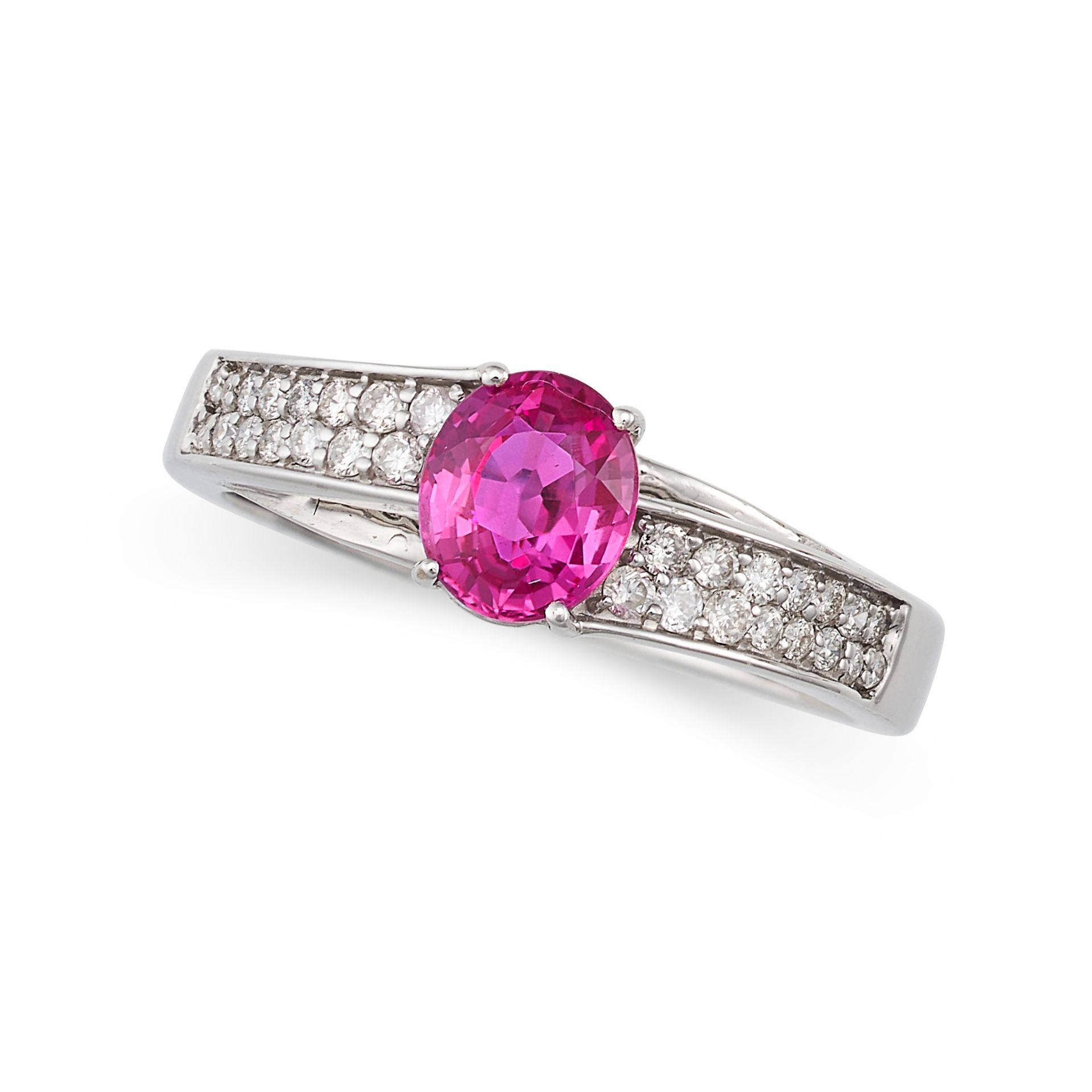 A RUBY AND DIAMOND RING in 18ct white gold, set with an oval cut ruby of 0.78 carats, the band ac...