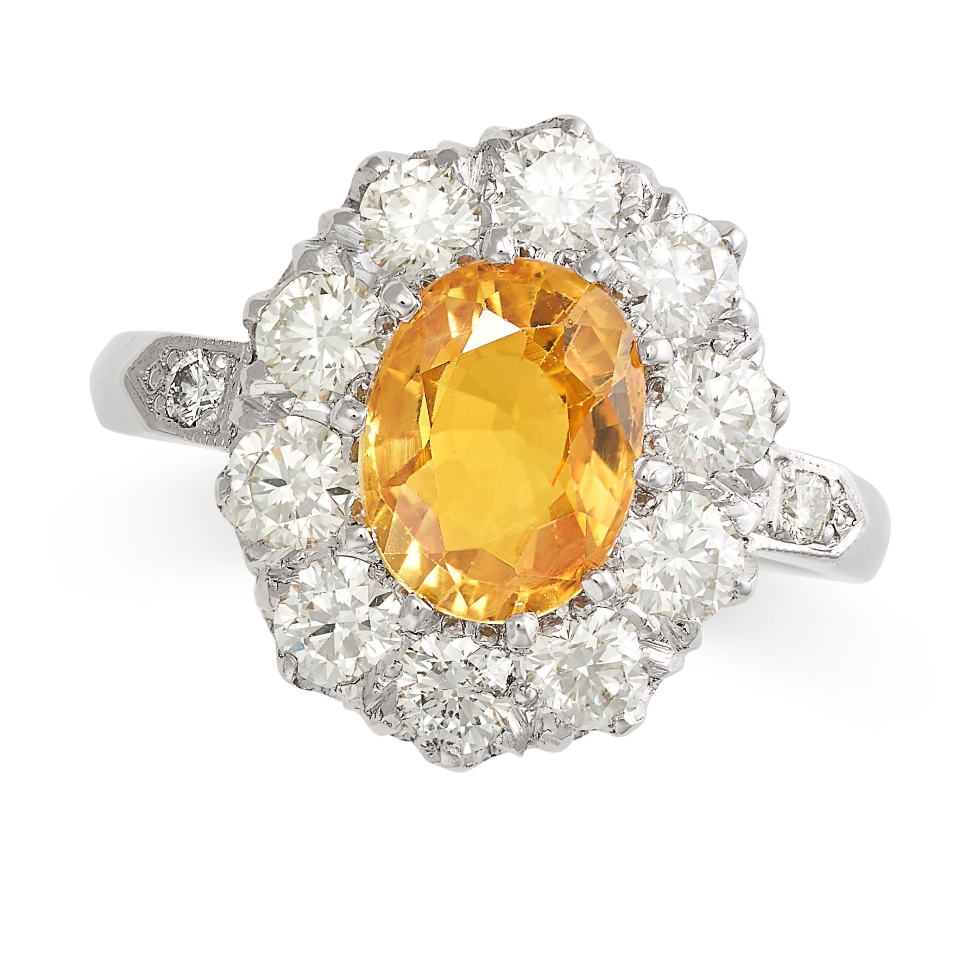 A YELLOW SAPPHIRE AND DIAMOND CLUSTER RING in platinum, set with an oval cut yellow sapphire of a...