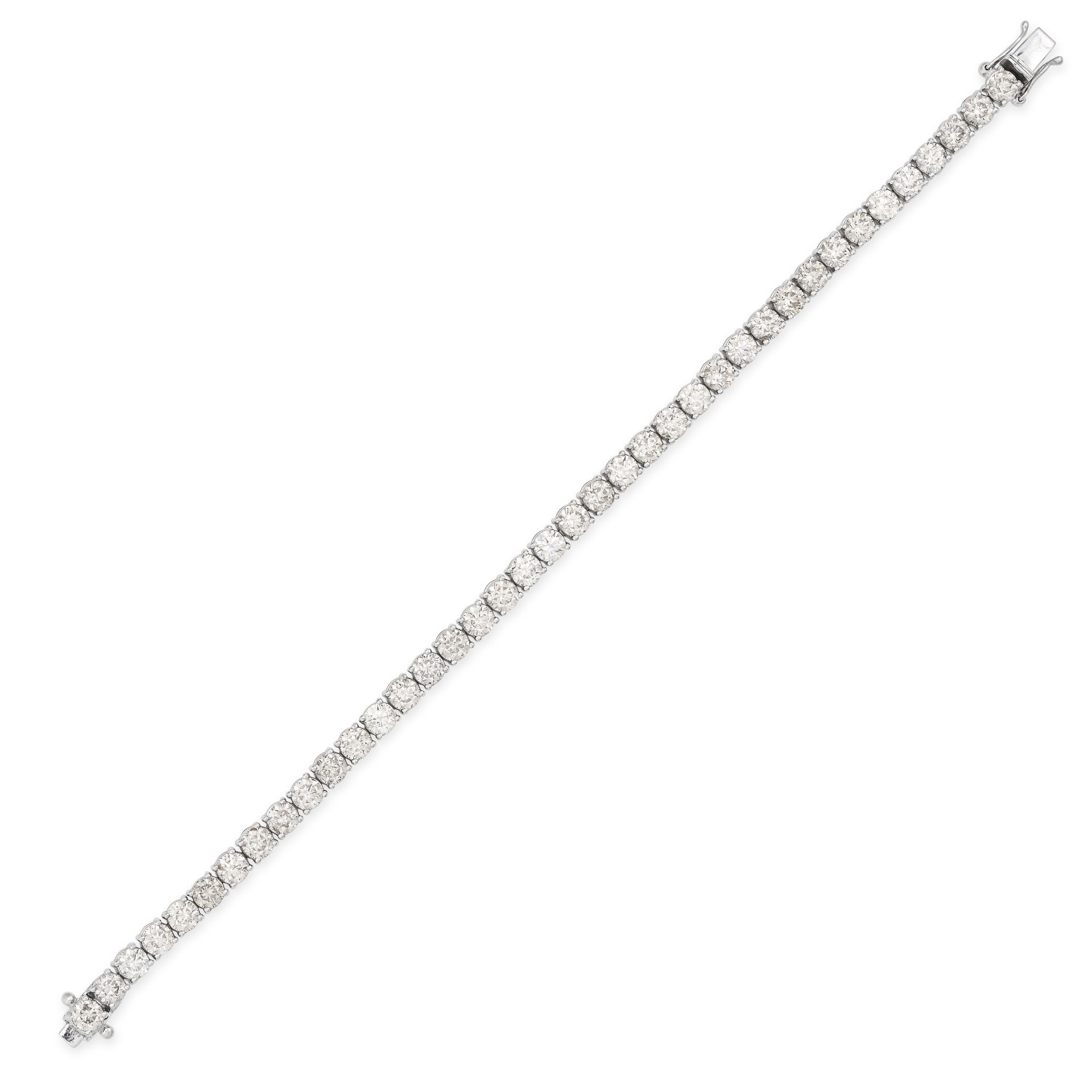 A DIAMOND LINE BRACELET in 18ct white gold, comprising a row of round brilliant cut diamonds, the...