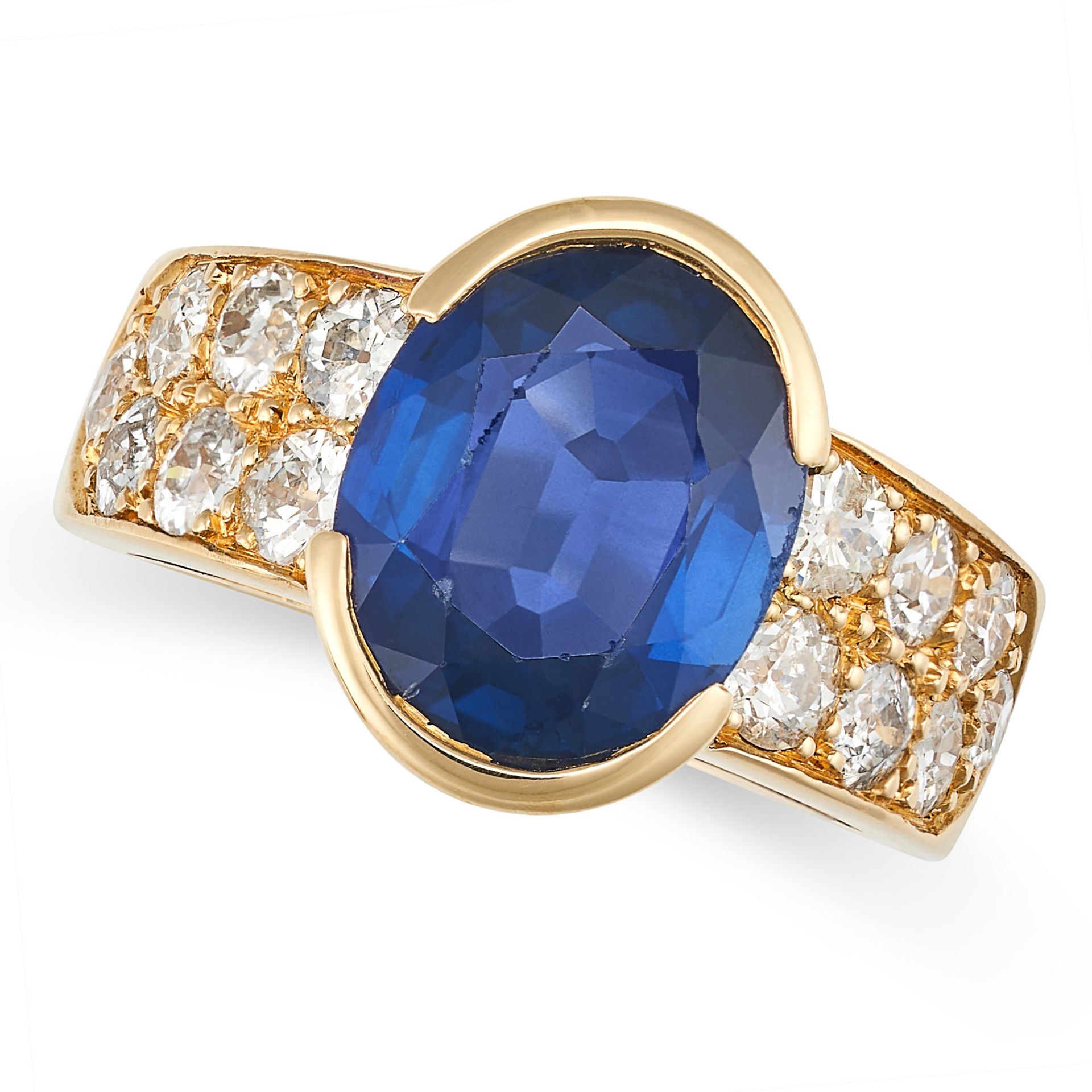 A FRENCH SAPPHIRE AND DIAMOND RING in 18ct yellow gold, set with an oval cut sapphire of approxim...