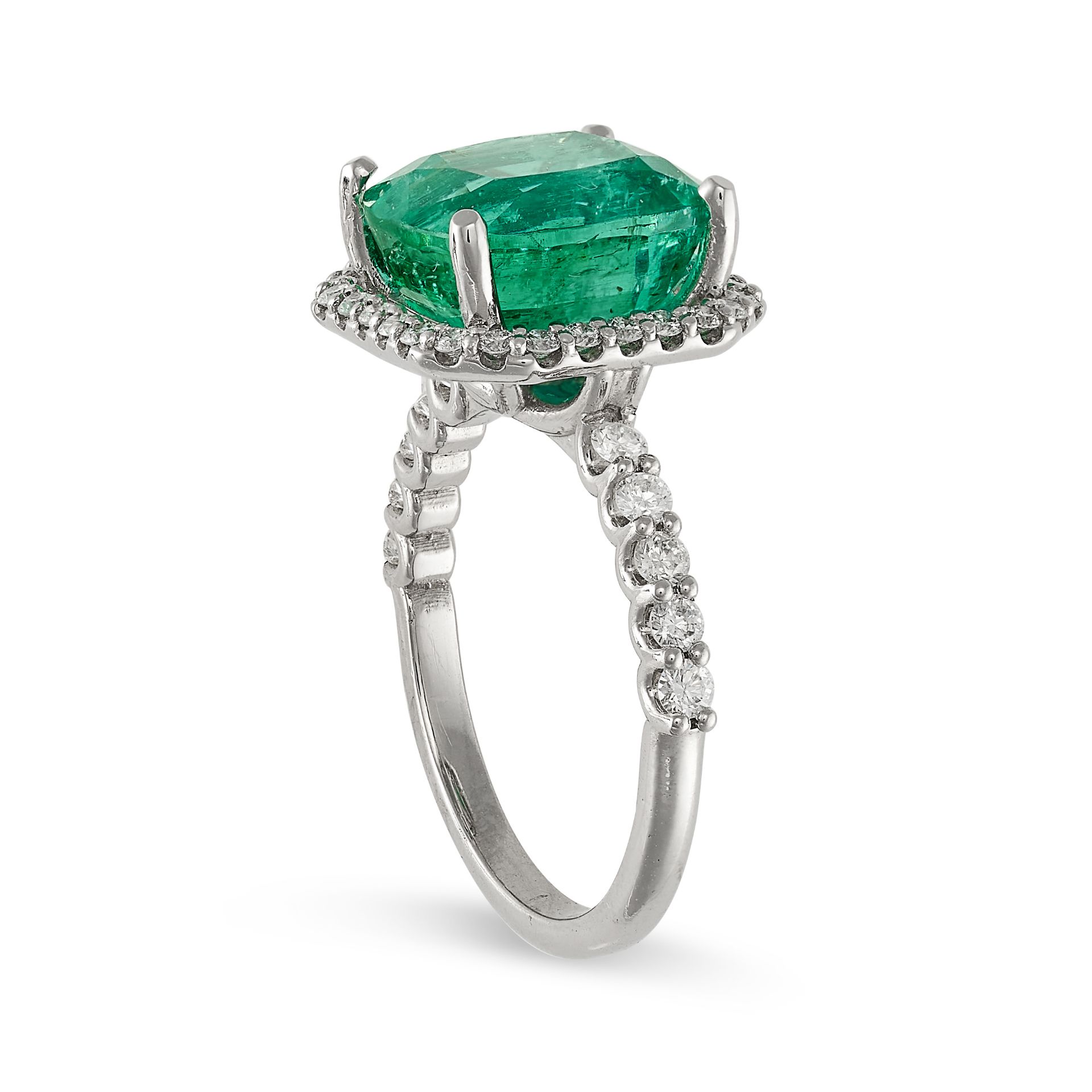 AN EMERALD AND DIAMOND RING in platinum, set with a cushion cut emerald of 6.08 carats in a borde... - Image 2 of 2