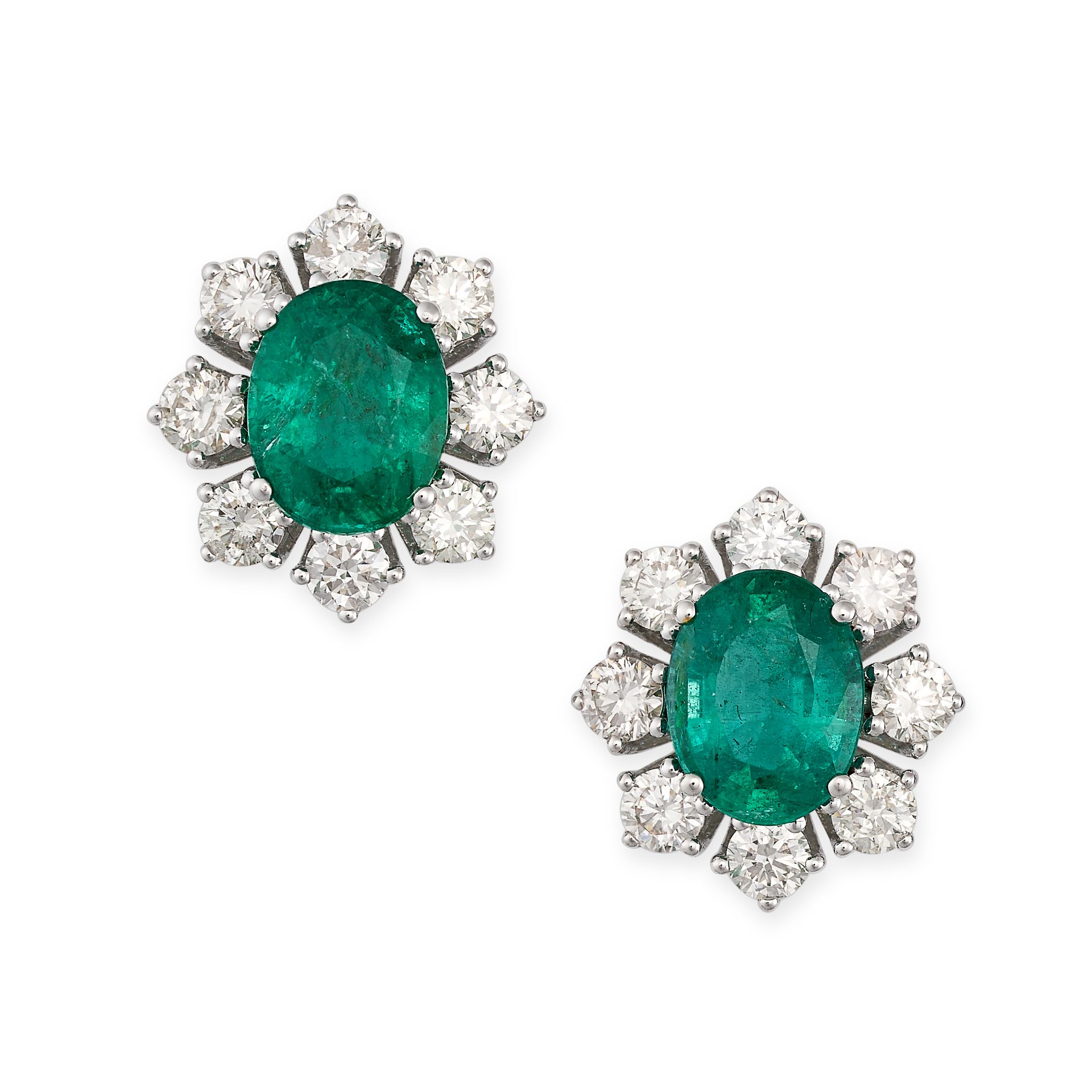 A PAIR OF EMERALD AND DIAMOND CLUSTER EARRINGS in 18ct white gold, each set with an oval cut emer...