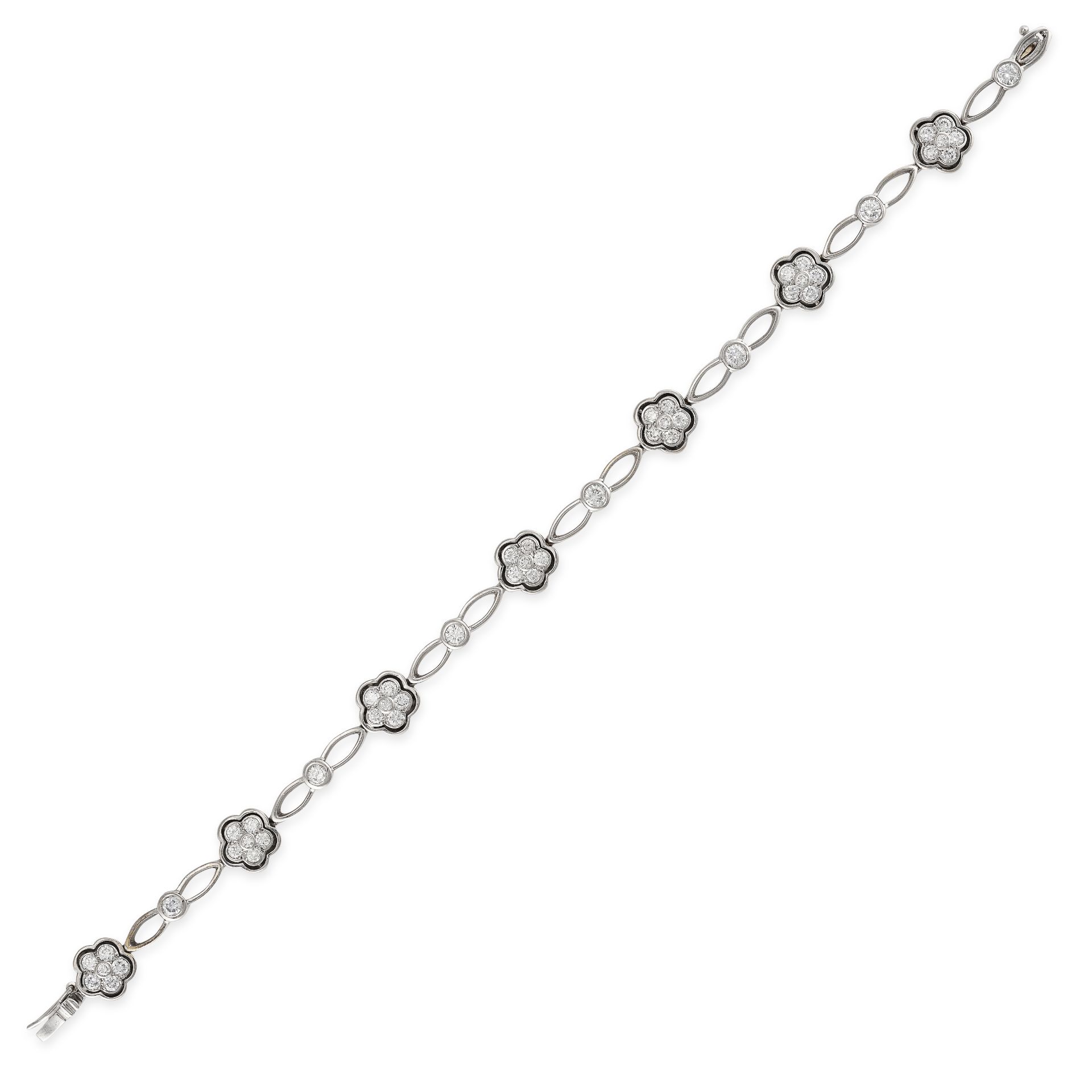 A VINTAGE DIAMOND BRACELET in 18ct white gold, set with seven round brilliant cut diamond cluster...