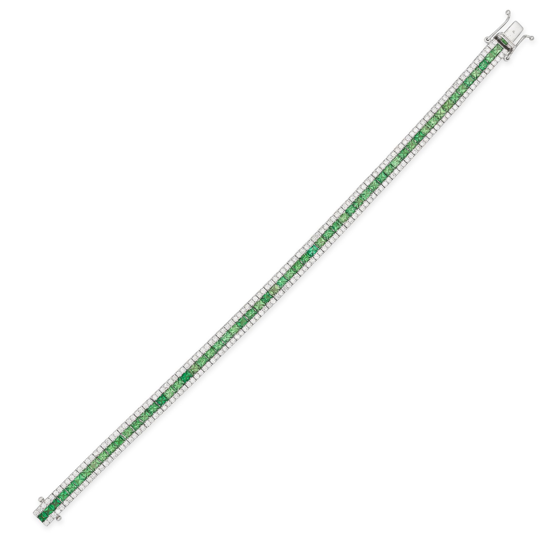 A TSAVORITE GARNET AND DIAMOND LINE BRACELET in white gold, set with a row of rectangular step cu...