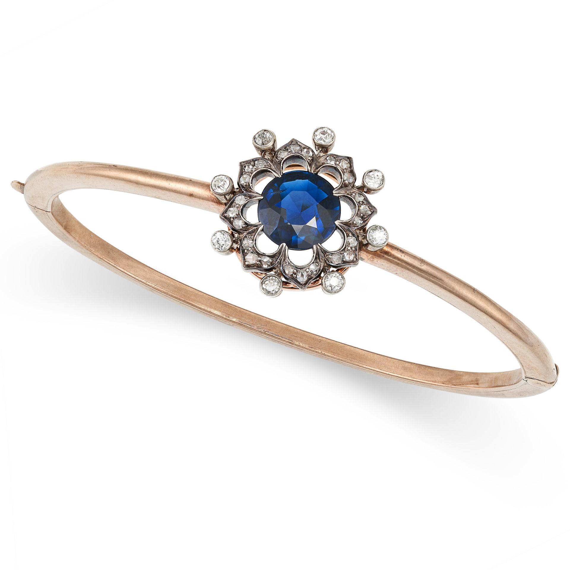 AN ANTIQUE SAPPHIRE AND DIAMOND BANGLE in yellow gold,  the hinged bangle set with a round cut sa...