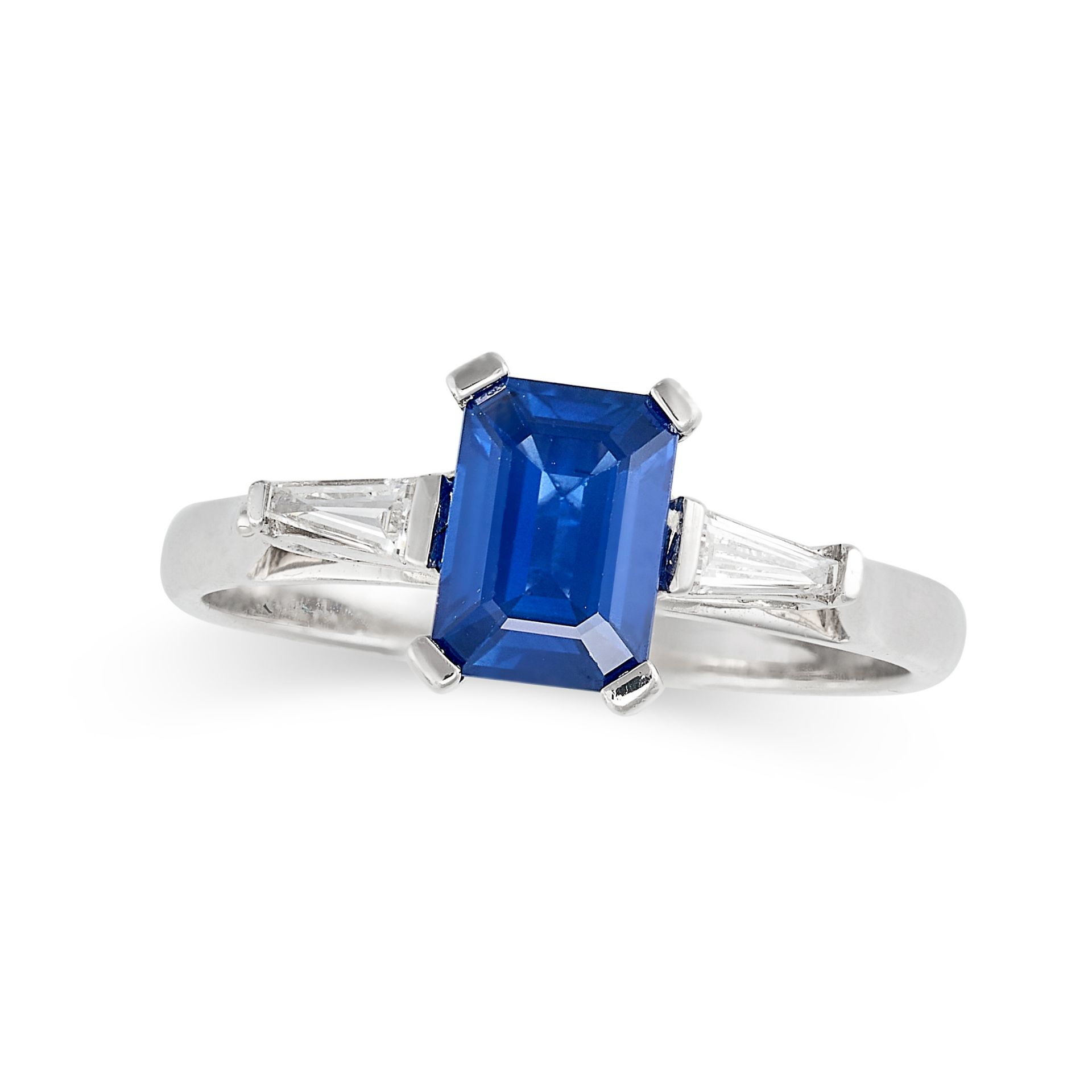 A SAPPHIRE AND DIAMOND RING in 18ct white gold, set with a rectangular step cut sapphire of 1.14 ...