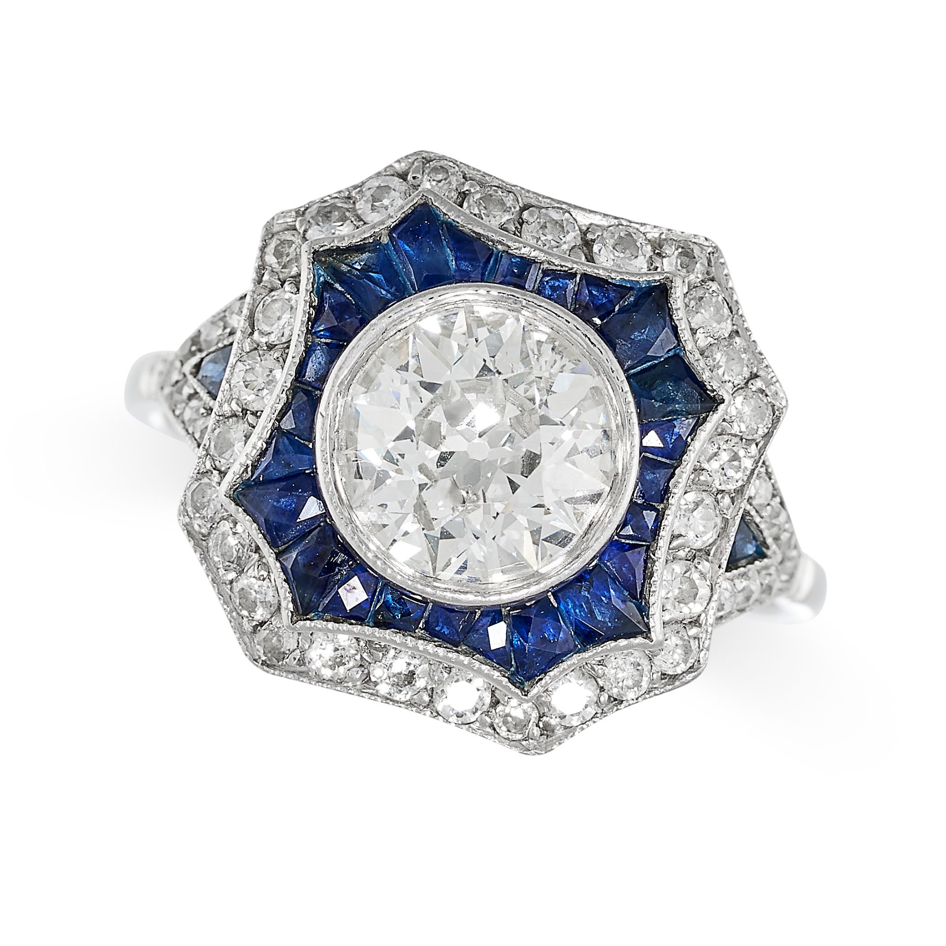 AN ART DECO SAPPHIRE AND DIAMOND DRESS RING in platinum, set with an old cut diamond of approxima...