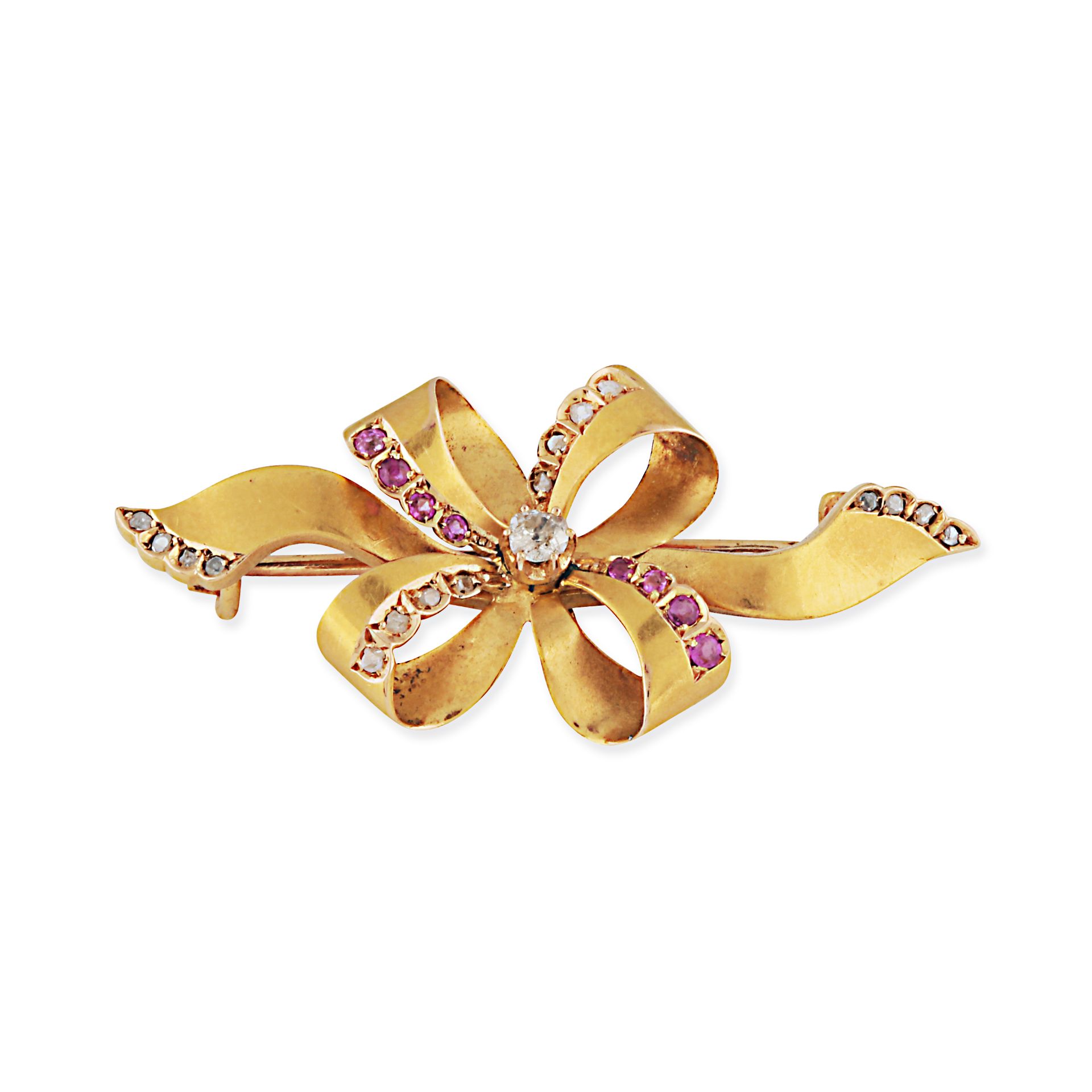 A VINTAGE RUBY AND DIAMOND BOW BROOCH in 18ct yellow gold, designed as a ribbon tied as a bow, se...