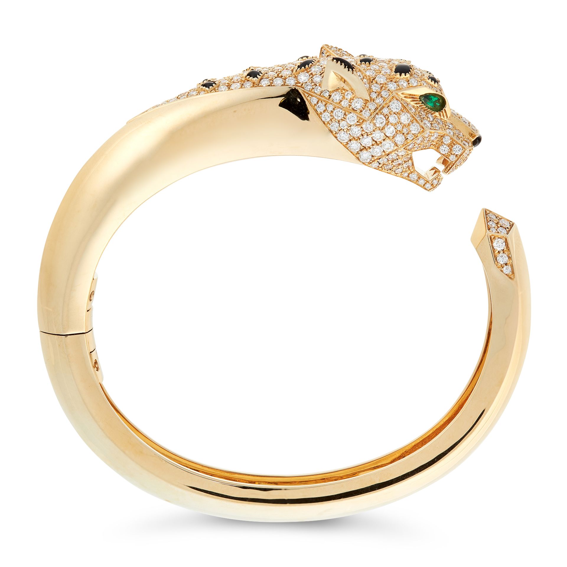 A DIAMOND, ONYX AND EMERALD PANTHER BANGLE in 18ct yellow gold, designed as a coiled panther, set... - Image 2 of 2